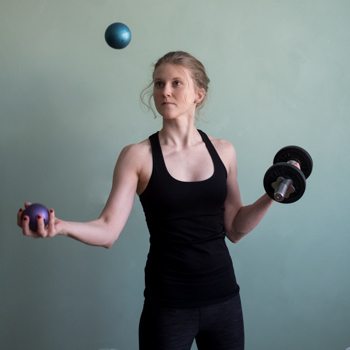 Improving coordination through juggling while holding dumbbell
