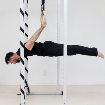 Hand Wraps, Grips, & Other Hand Care Methods for Using Gymnastic Rings 4 Ryan Hurst practicing a level on gymnastics rings