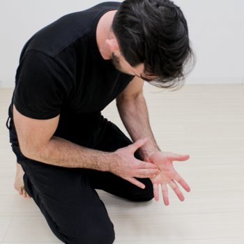 Hand Wraps, Grips, & Other Hand Care Methods for Using Gymnastic Rings 5 Ryan Hurst massaging his hand muscles