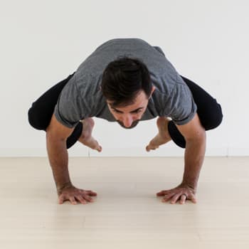 How to Get into the Crow Pose, Even if You've Never Been Able to Do It 1 Ryan in crow pose