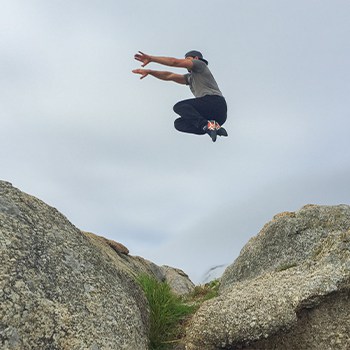 GMB Head Coach Ryan Hurst jumping outdoors