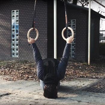 German Hang Tutorial: Use Gymnastic Rings to Improve Shoulder Mobility 2 german hang head on ground technique