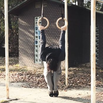 German Hang Tutorial: Use Gymnastic Rings to Improve Shoulder Mobility 4 german hang jump face down technique