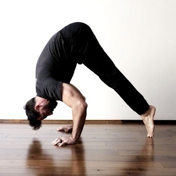Training While Traveling: Maintaining an Exercise Routine On The Go 4 Ryan doing an inverted press exercise