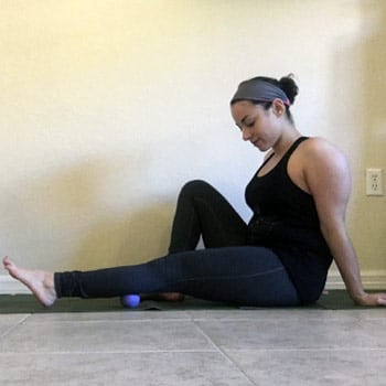 Active Recovery: Your Guide To Moving Better With Less Pain 1 Rachel doing a trigger point massage on her muscles