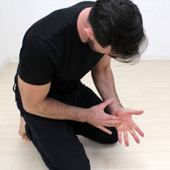 How to Get into the Crow Pose, Even if You've Never Been Able to Do It 8 Ryan massaging his hands