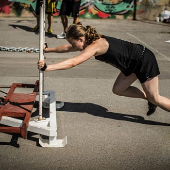 Alicia pushing weight sled