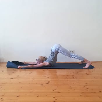 Alicia doing a back flexibility exercise