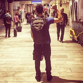 Training While Traveling: Maintaining an Exercise Routine On The Go 1 Chris carrying back pack