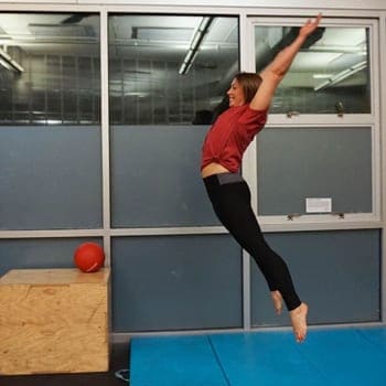 Training While Traveling: Maintaining an Exercise Routine On The Go 3 Stacey doing a jump exercise