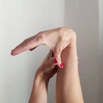 Beighton test - pulling thumb back to touch forearm