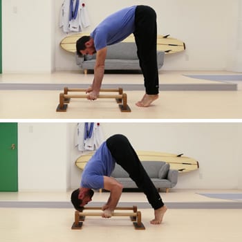 Build Up Your Bent Arm Strength With Parallettes Push Ups & Dips 5 Ryan doing an inverted press on parallettes