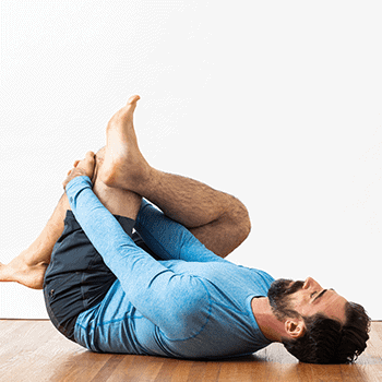 Tight Hamstrings? Effective Stretches and 6 Tips for Hamstring Flexibility 3 lying on floor pulling leg into chest hamstring stretch