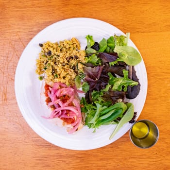 salad and fish on plate