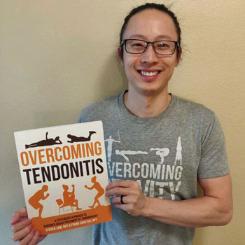 Tendon Strength & Connective Tissue Health 15 Steven Low holding a copy of Overcoming Tendonitis