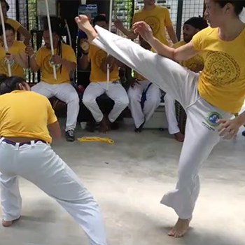 She Had to Start Over after 4 Kids - Now at 39 She's Stronger than Ever 3 Michelle Ho practicing capoeira