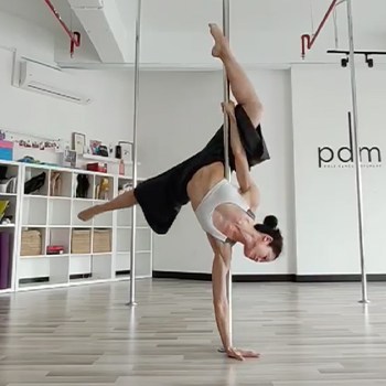 She Had to Start Over after 4 Kids - Now at 39 She's Stronger than Ever 2 Michelle Ho practicing pole dancing