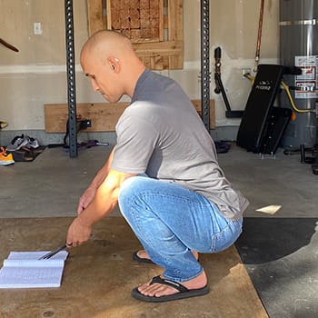It's easy to squat in jeans if you can squat well in workout clothes. Jarlo in full squat while wearing jeans.
