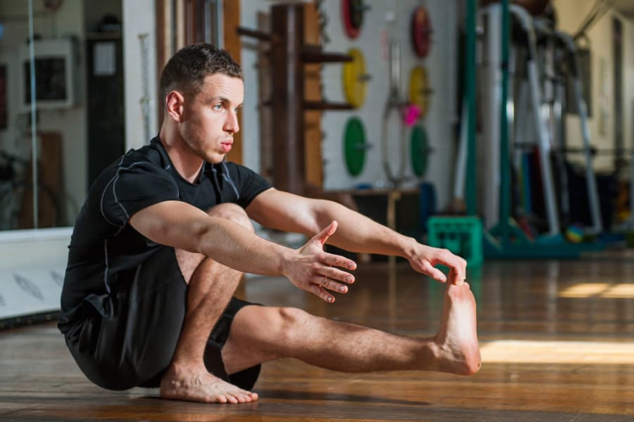 A GMB Trainer practicing a pistol squat