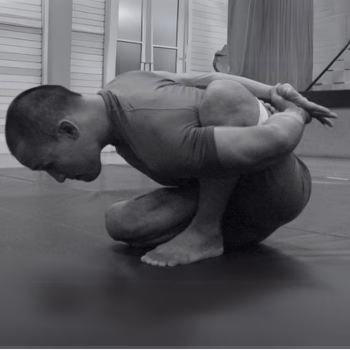GMB vs Yoga: Comparing Practice, Process, and Purpose 2 Man performing the yoga pose marichyasana b