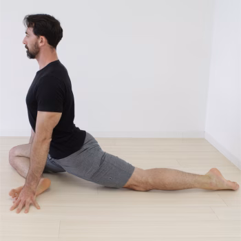 GMB vs Yoga: Comparing Practice, Process, and Purpose 5 man performing pigeon pose from yoga