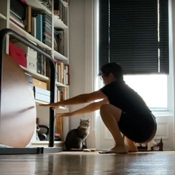 Fixing 30 Years of Deskbod: How this Graphic Designer Loosened Painful Joints and Got Strong 4 GMB Elements client Kamomi training in her apartment with her cat