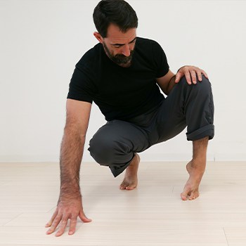 GMB Head Coach Ryan Hurst practicing a foot and ankle mobility exercise