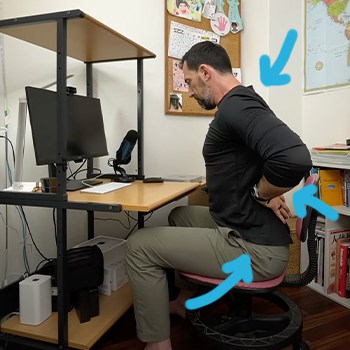 Arrows pointing to areas of tightness and aches from deskwork