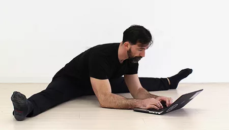 GMB Head Coach Ryan Hurst doing a Pancake while working on his laptop