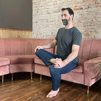 Seated piriformis stretch for squat mobility