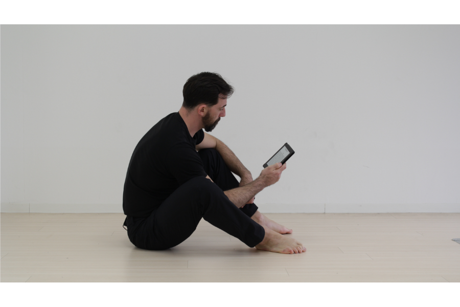 Man Sitting and Reading