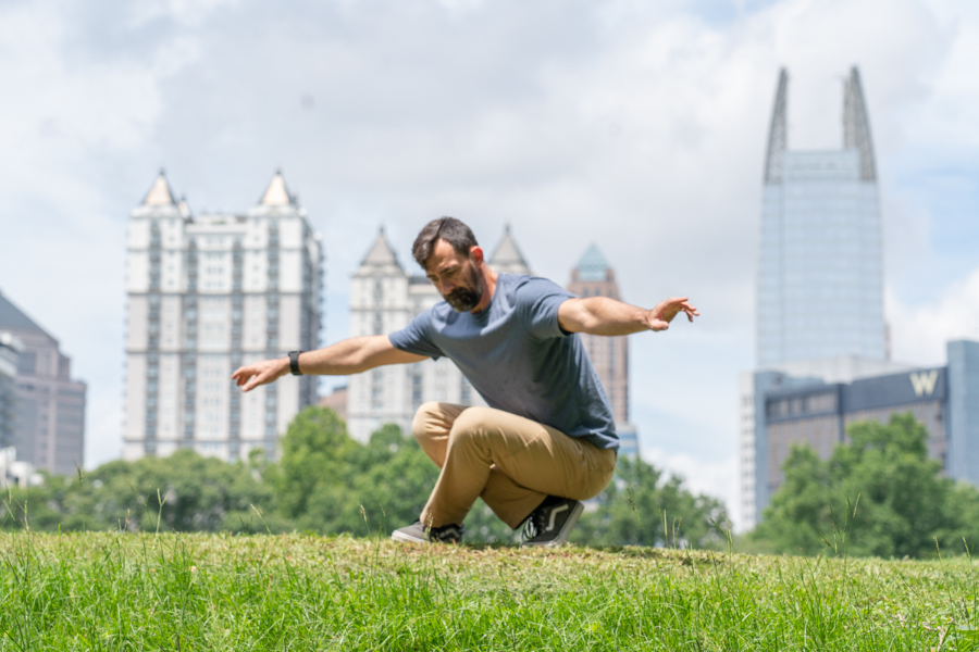 Colt squat leg exercise on grassy field