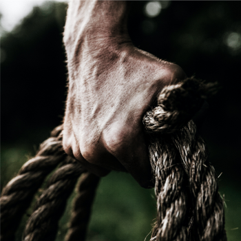 Grip Strength: How to Develop a Capable and Resilient Grip 2 Man gripping rope