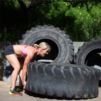 Smart Conditioning Strategies: How to Integrate Cardio into Your Routine 4 Woman flipping tire