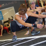 Women exercising in squatting locomotions