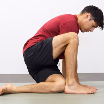 Man kneeling on ground